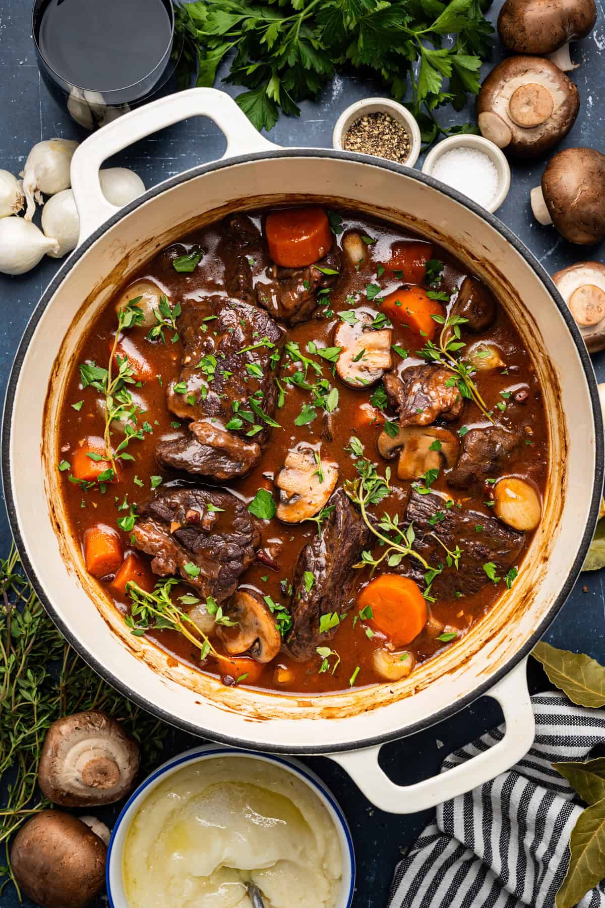 Beef Bourguignon in a white Dutch oven.