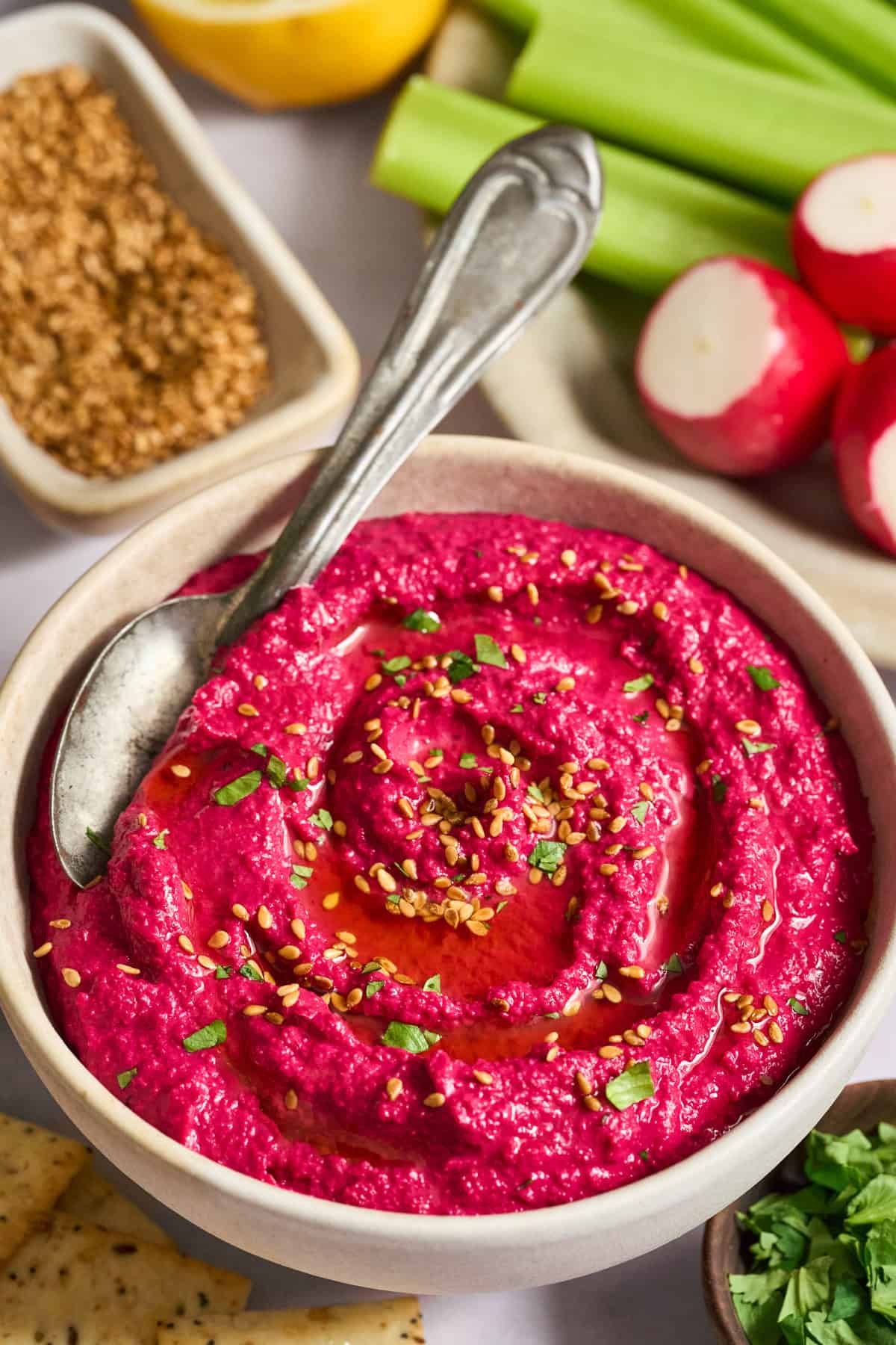 Beet Hummus in a white bowl.