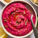 Beet Hummus in a white bowl.