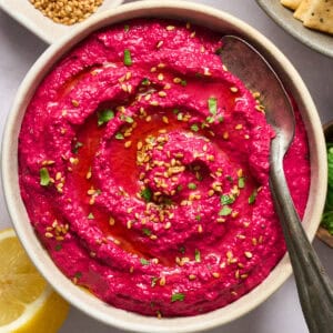 Beet Hummus in a white bowl.