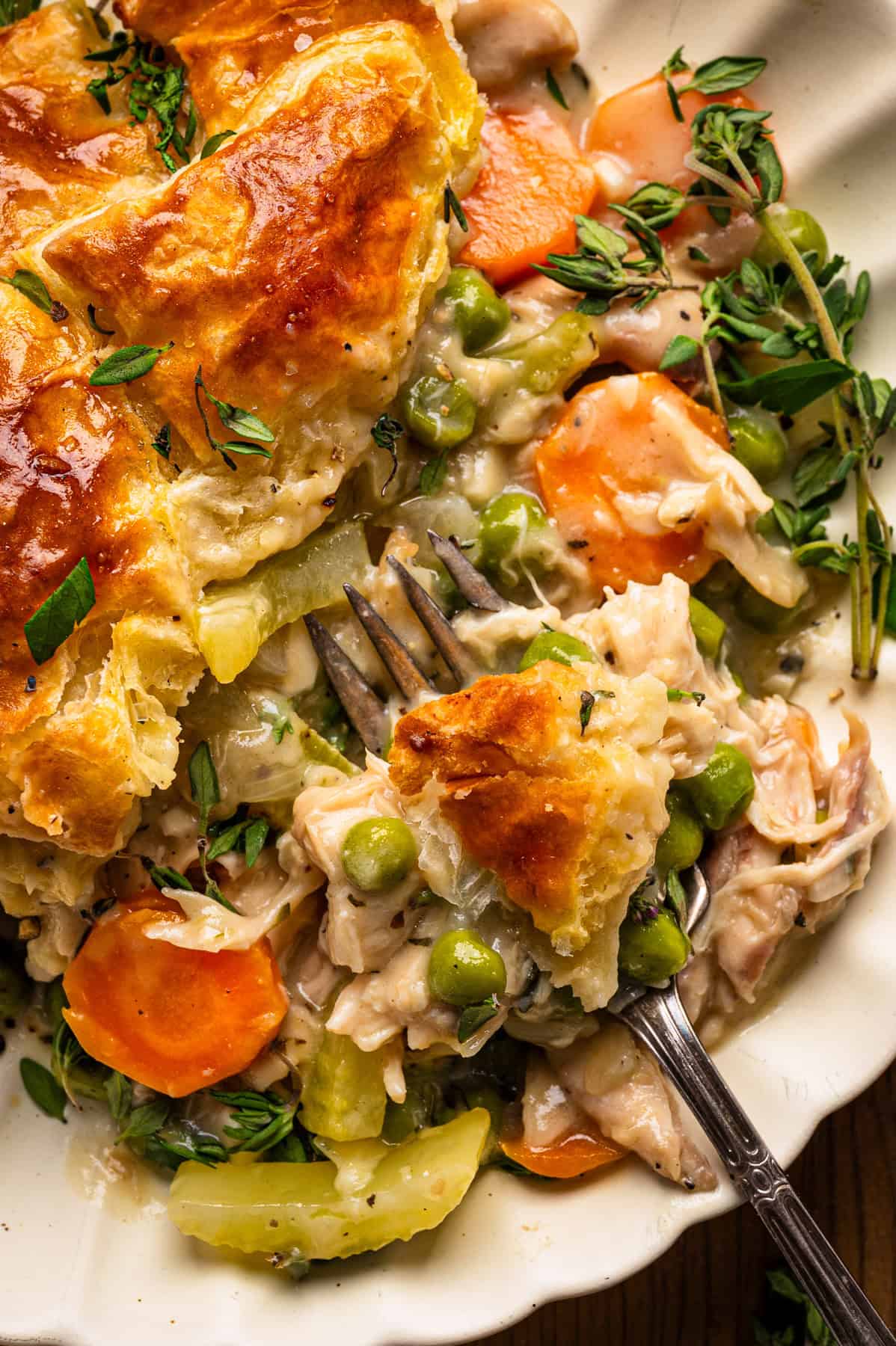 Puff Pastry Chicken Pot Pie Puff Pastry Chicken Pot Pie on a white plate.