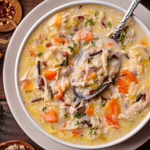 Creamy Chicken & Wild Rice Soup with Carrots in a bowl.