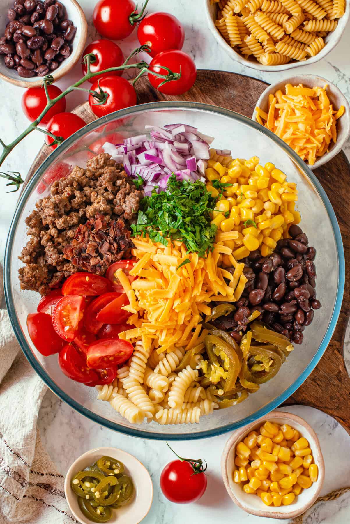 All ingredients for the Cowboy Pasta Salad arranged in a bowl.