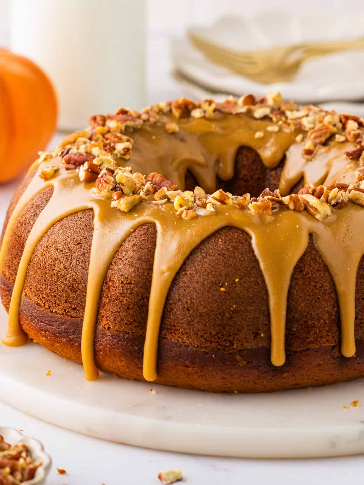 Pumpkin Bundt Cake Topped with Brown Sugar Glaze and Pecans.