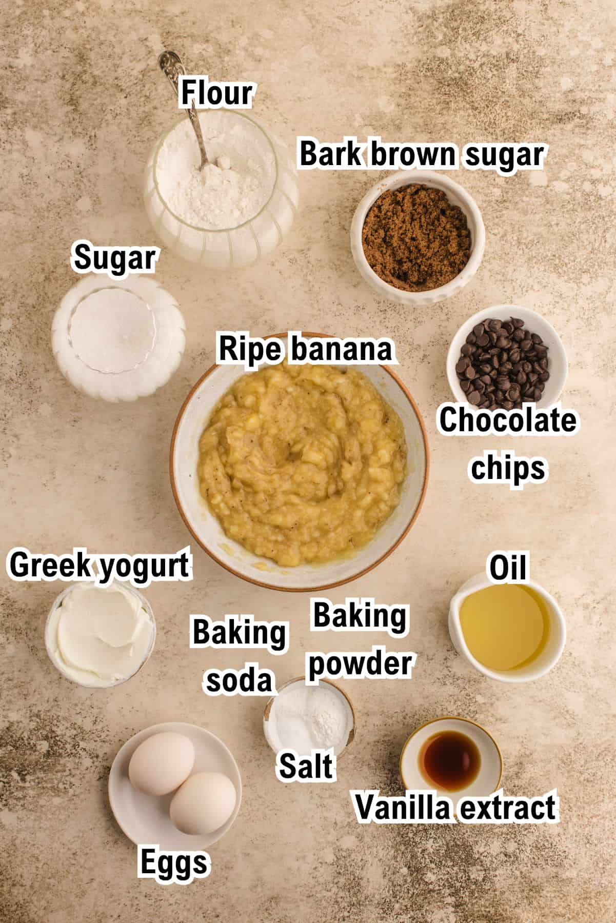 This photo shows all the ingredients (labeled) required for Banana Chocolate Chip Muffins.