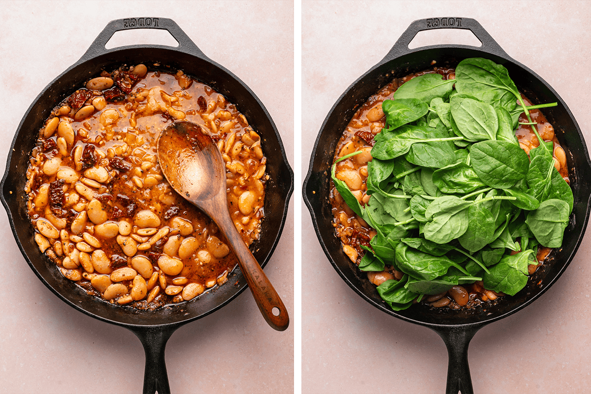 Mashing some of the beans using the back of the wooden spoon against the side of the cast iron pan to thicken, then adding fresh spinach.