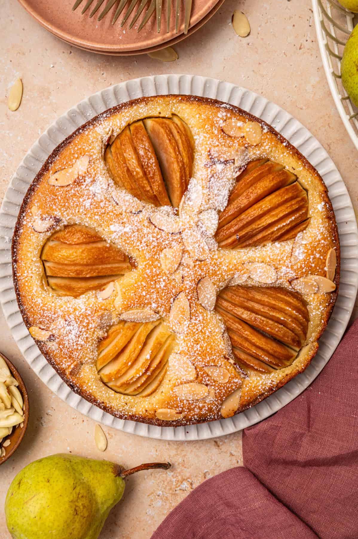 Pear Cake with Almond Flour, Almonds, and Fresh Pears Pear Cake with Almond Flour, Almonds, and Fresh Pears - on a large plate.