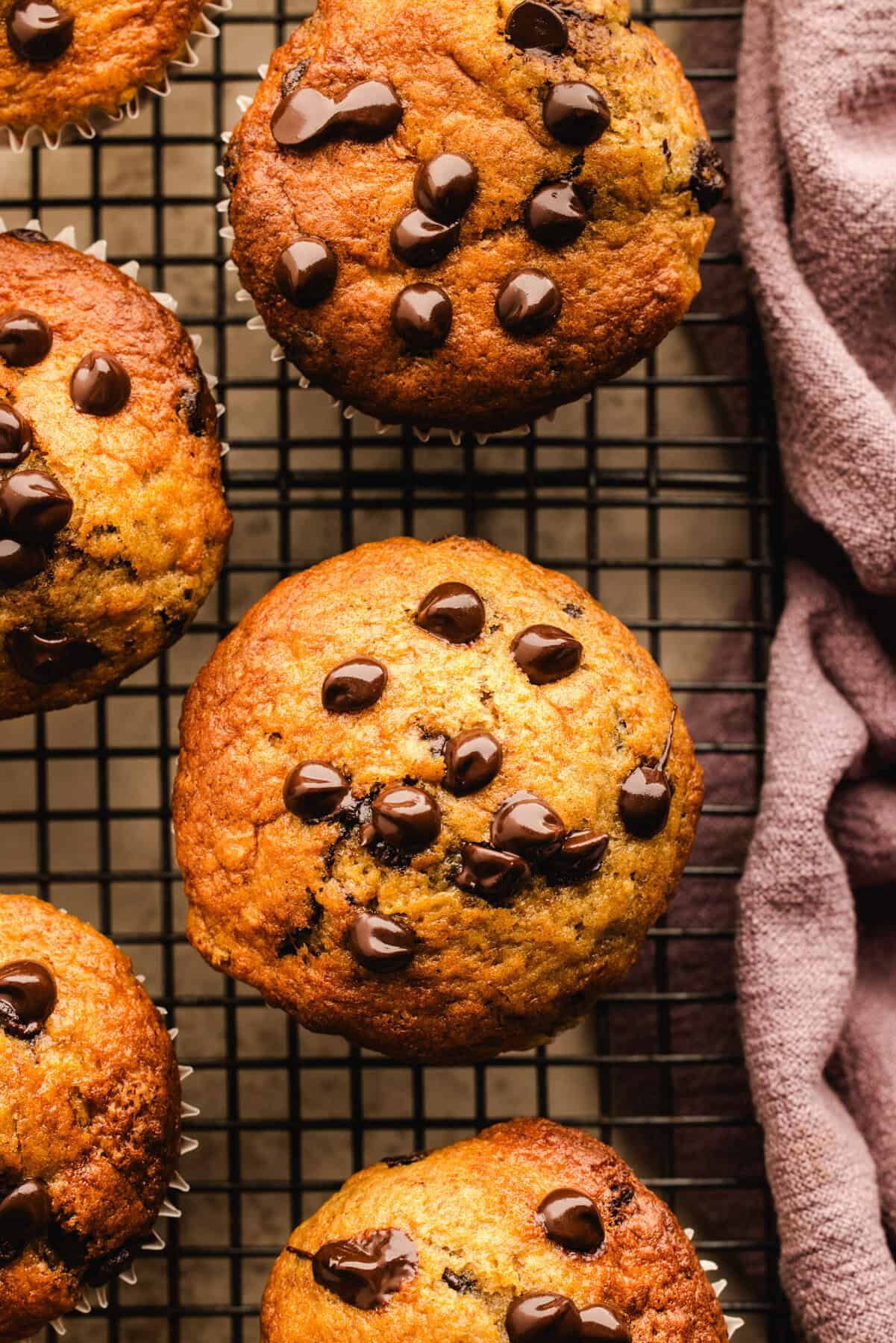 Banana Chocolate Chip Muffins on a rack.