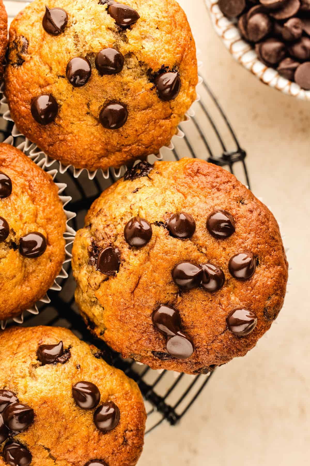 Banana Chocolate Chip Muffins on a rack.