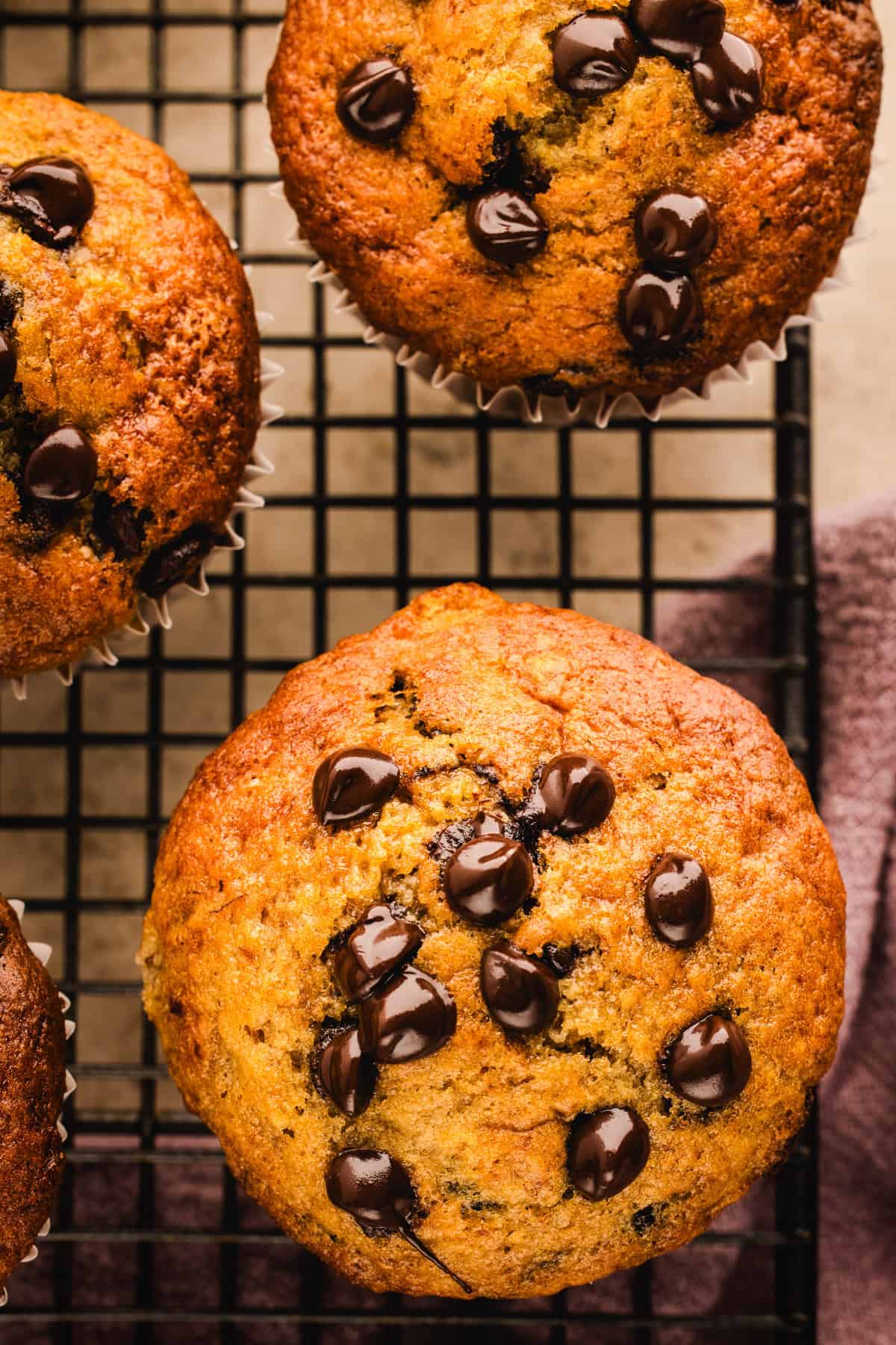Banana Chocolate Chip Muffins on a rack.