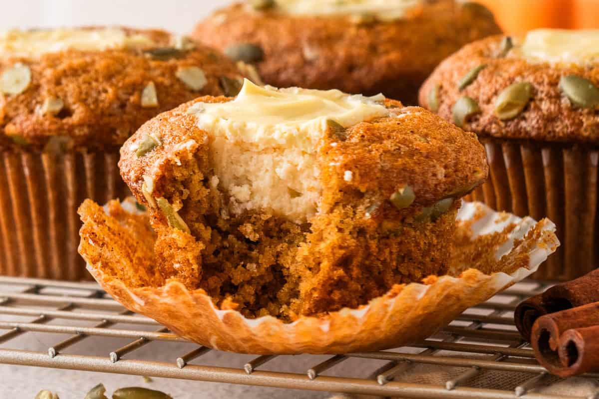 Pumpkin Cream Cheese Muffins Pumpkin Cream Cheese Muffins (with a small bite out).