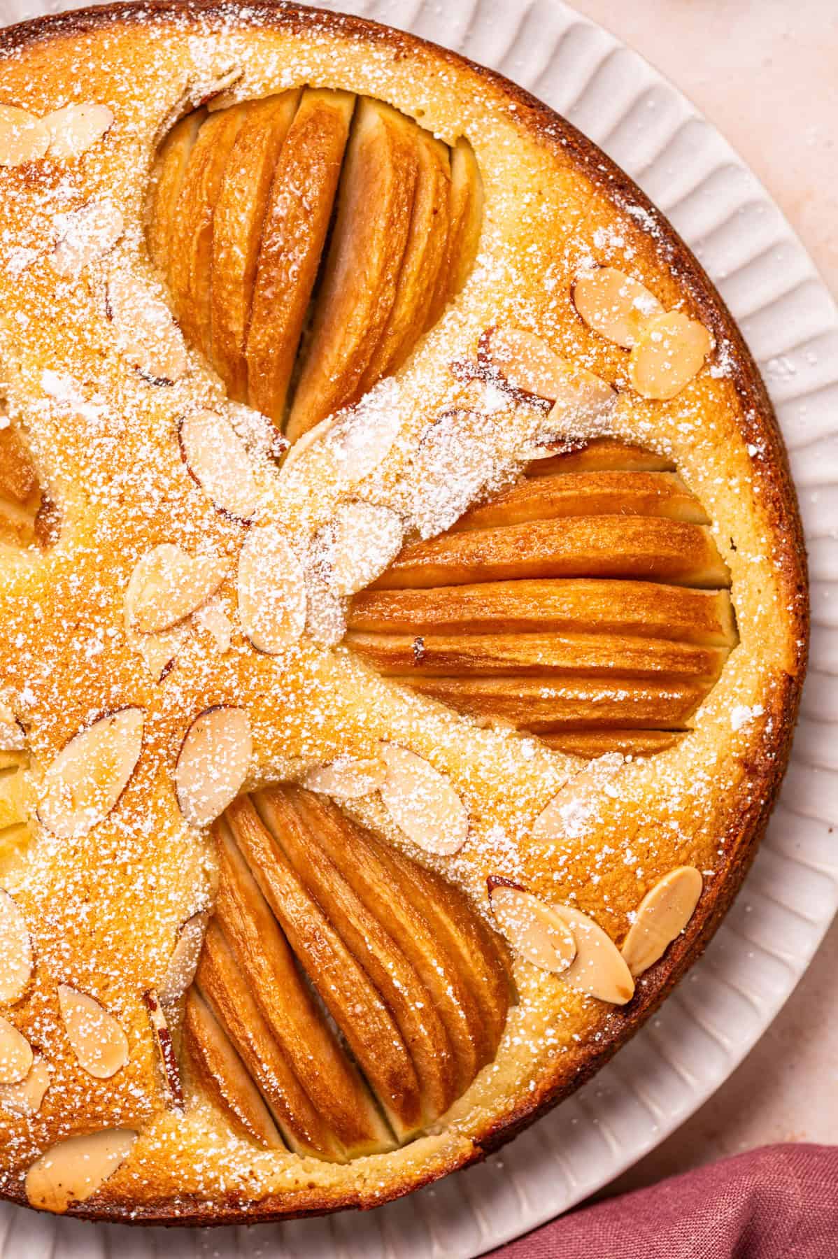 Pear Cake with Almond Flour, Almonds, and Fresh Pears Pear Cake with Almond Flour, Almonds, and Fresh Pears - on a large plate.