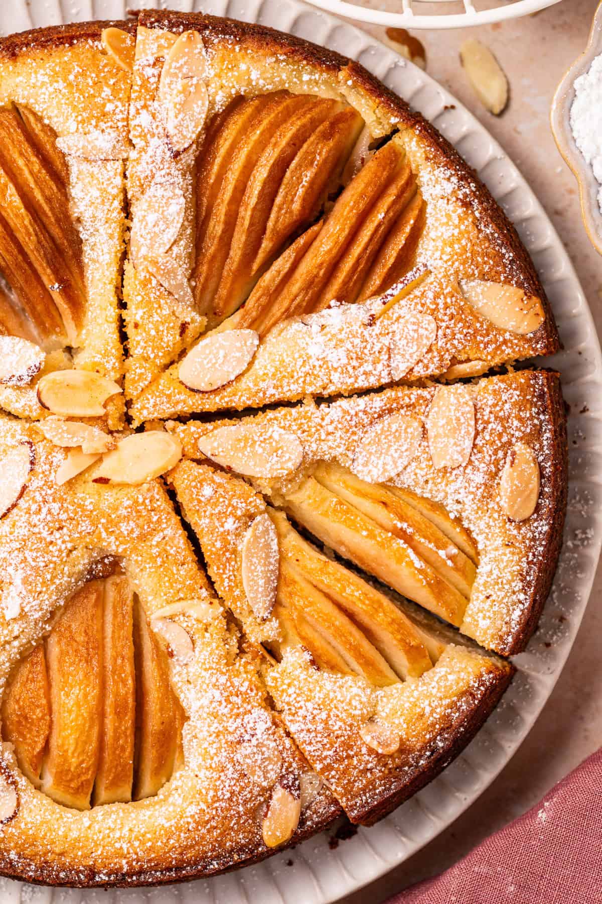 Pear Cake with Almond Flour, Almonds, and Fresh Pears Pear Cake with Almond Flour, Almonds, and Fresh Pears on a large plate.