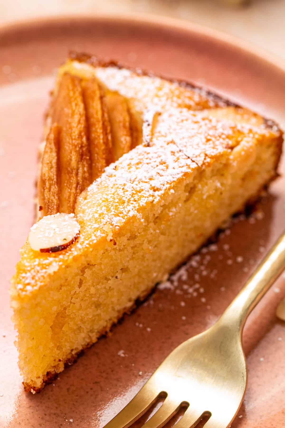 Pear Cake with Almond Flour, Almonds, and Fresh Pears A slice of Pear Cake on a plate.
