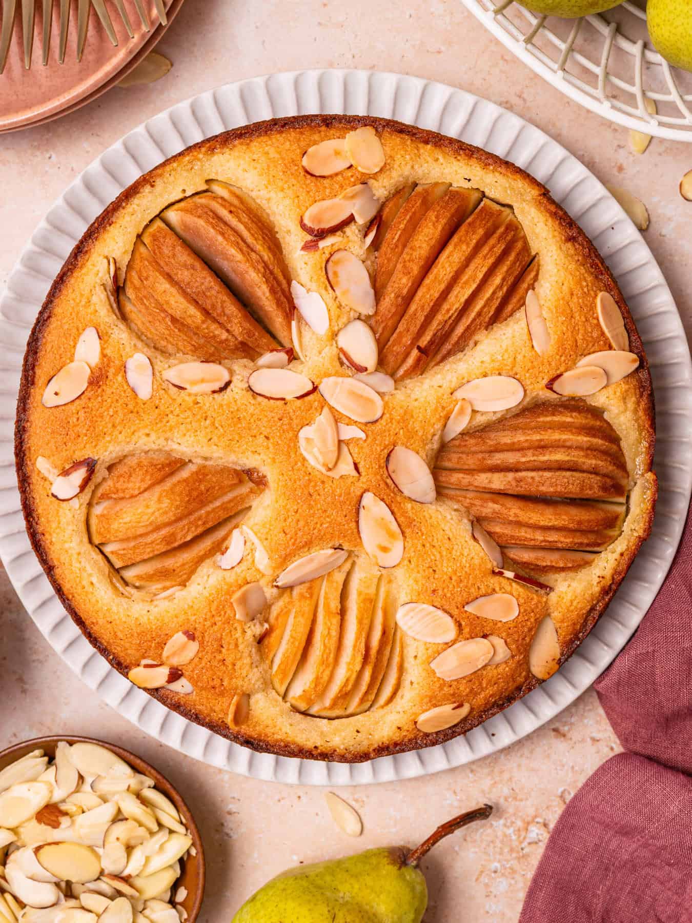 Pear Cake with Almond Flour, Almonds, and Fresh Pears Pear Cake with Almond Flour, Almonds, and Fresh Pears on a large plate.