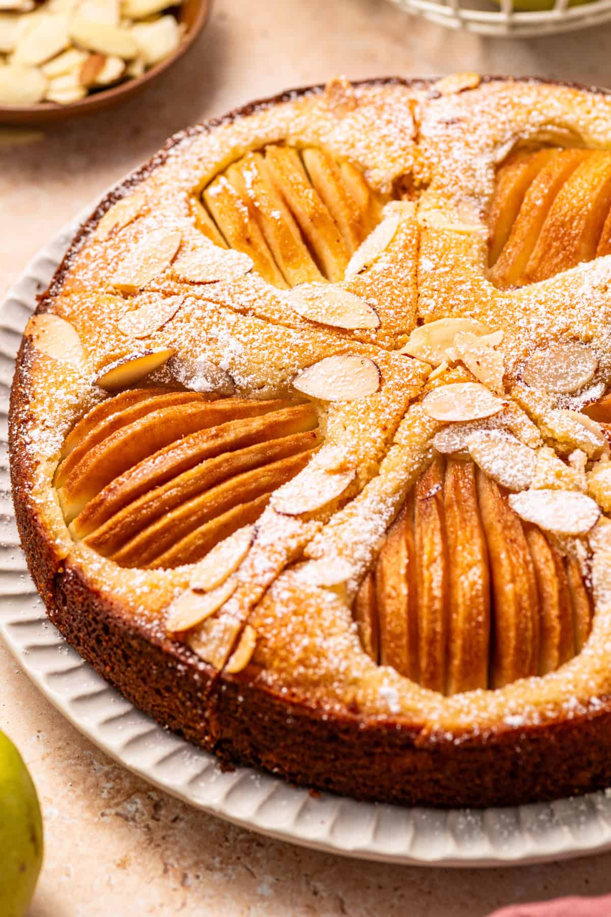 Pear Cake with Almond Flour, Almonds, and Fresh Pears Pear Cake with Almond Flour, Almonds, and Fresh Pears on a large plate.