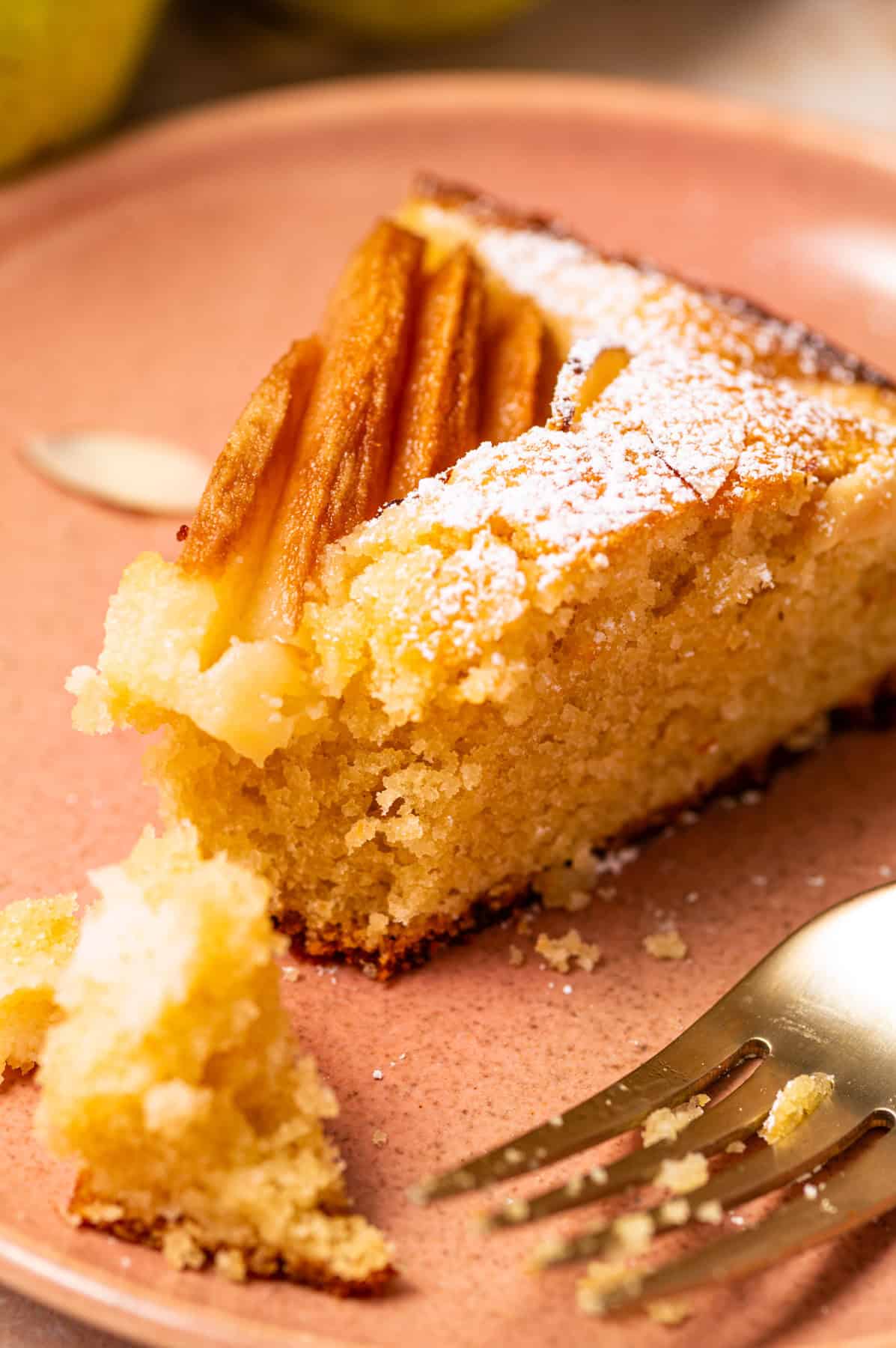 Pear Cake with Almond Flour, Almonds, and Fresh Pears A slice of pear cake on a plate.