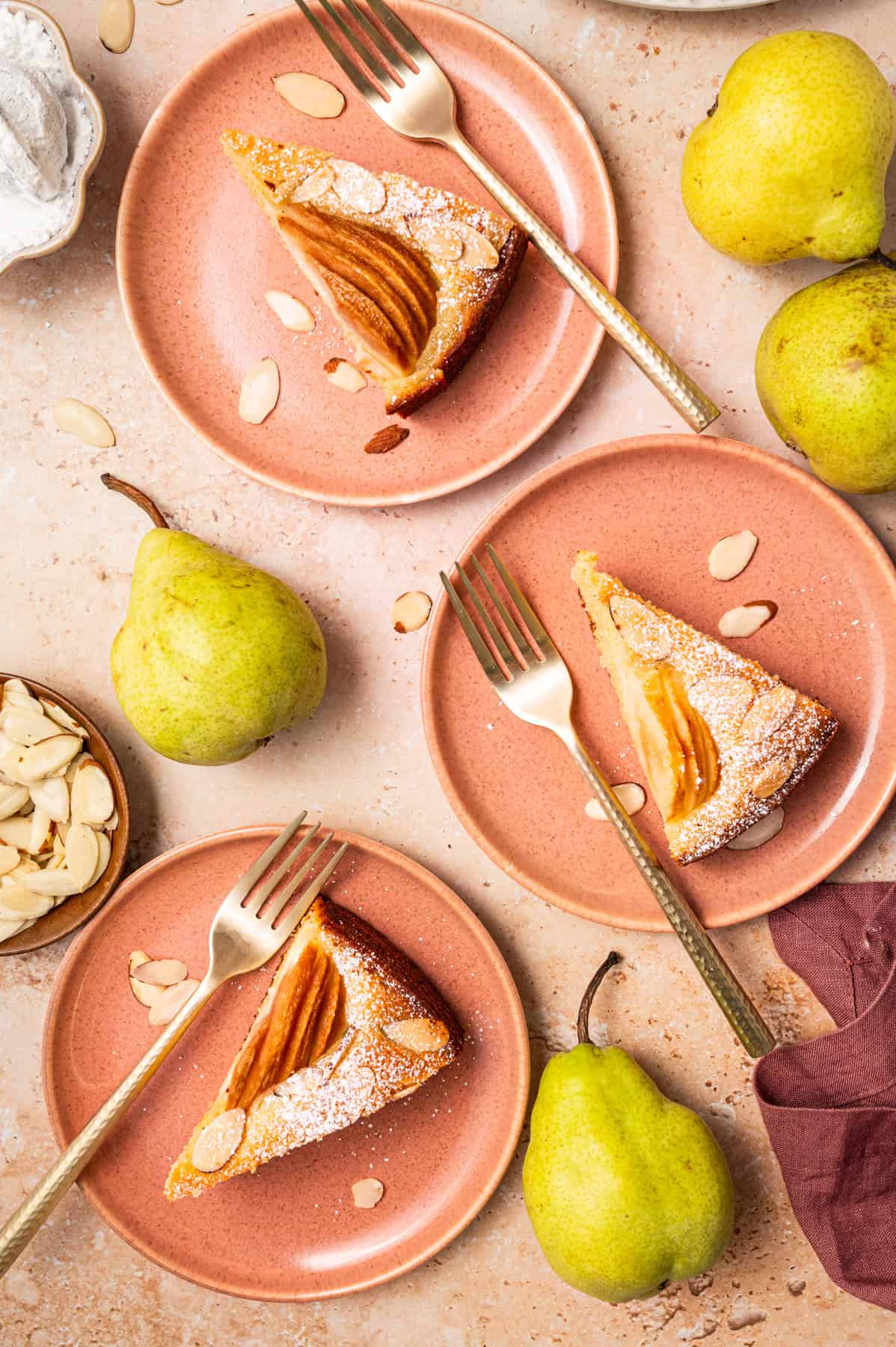 Pear Cake 3 plates each with a slice of pear cake.