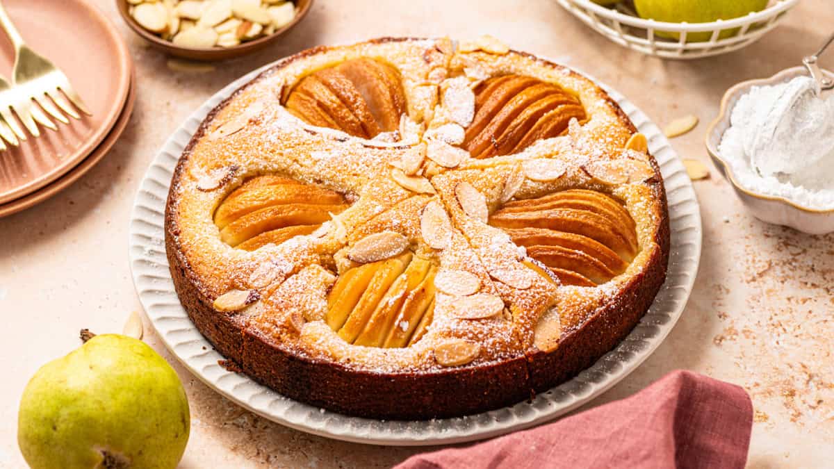 Pear Cake with Almond Flour, Almonds, and Fresh Pears Pear Cake with Almond Flour, Almonds, and Fresh Pears - on a large plate.