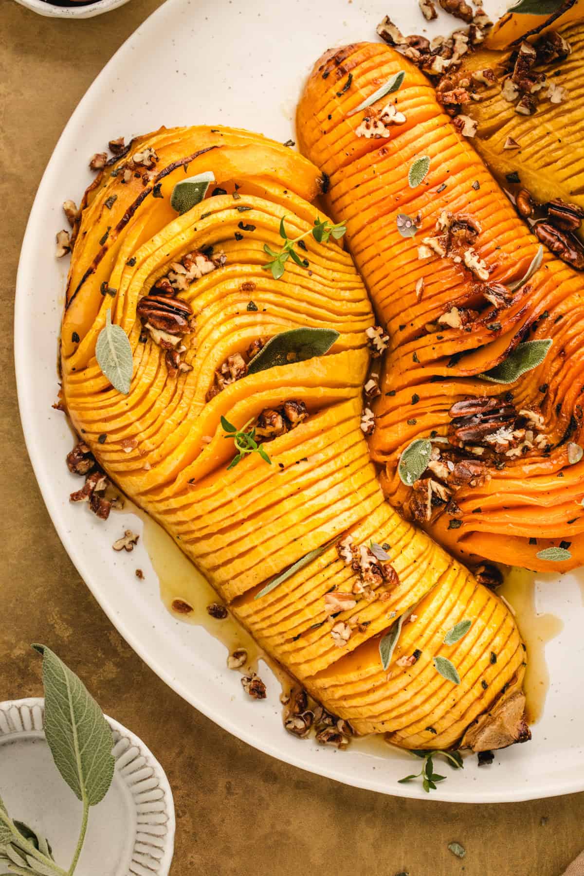 Hasselback Butternut Squash (2 squash halves on a white platter).