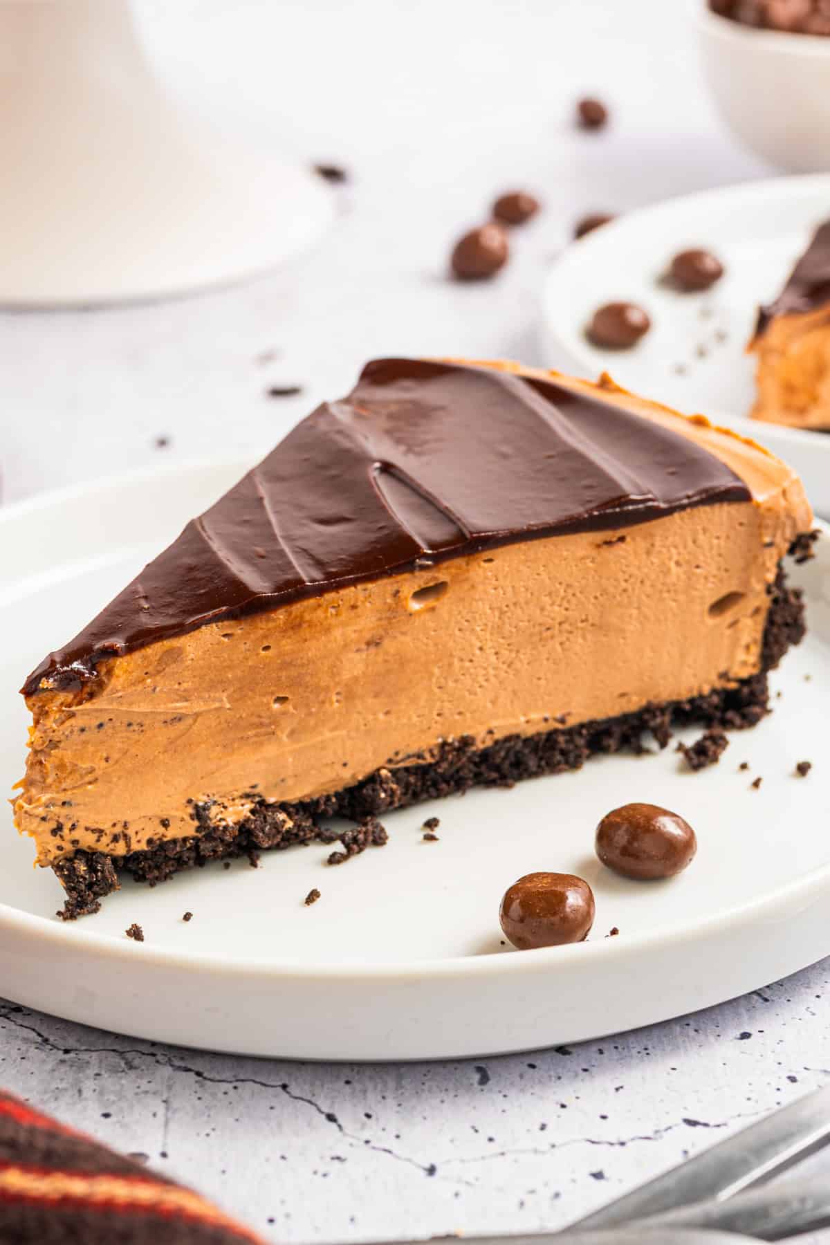 A slice of Mocha Cheesecake on a plate.