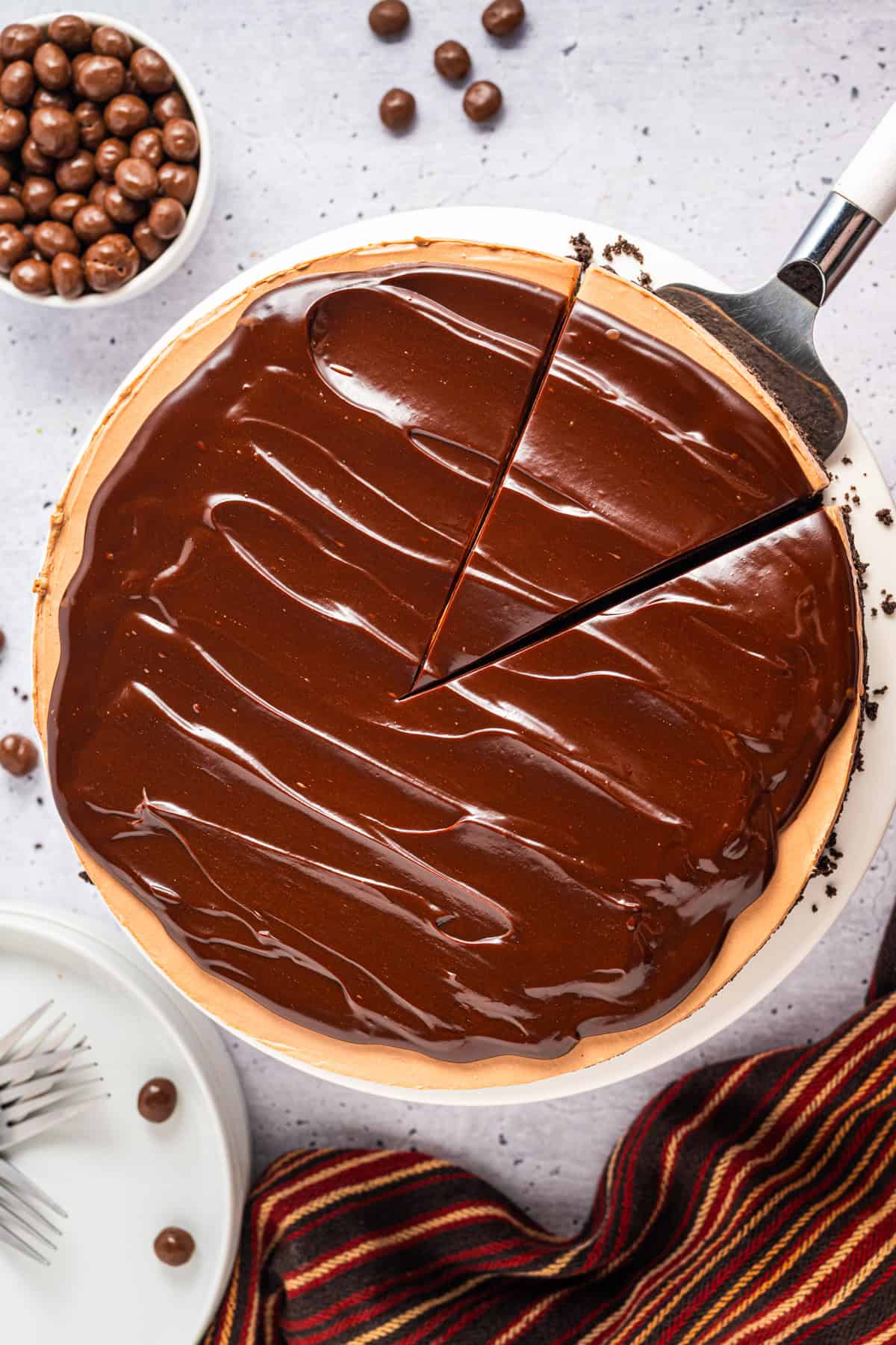 Overhead view of Mocha Cheesecake on a white background.