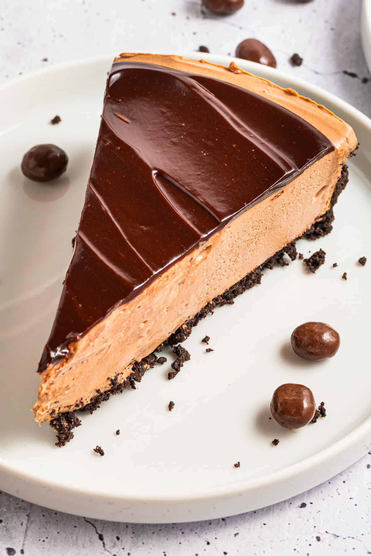 A slice of Mocha Cheesecake on a plate.