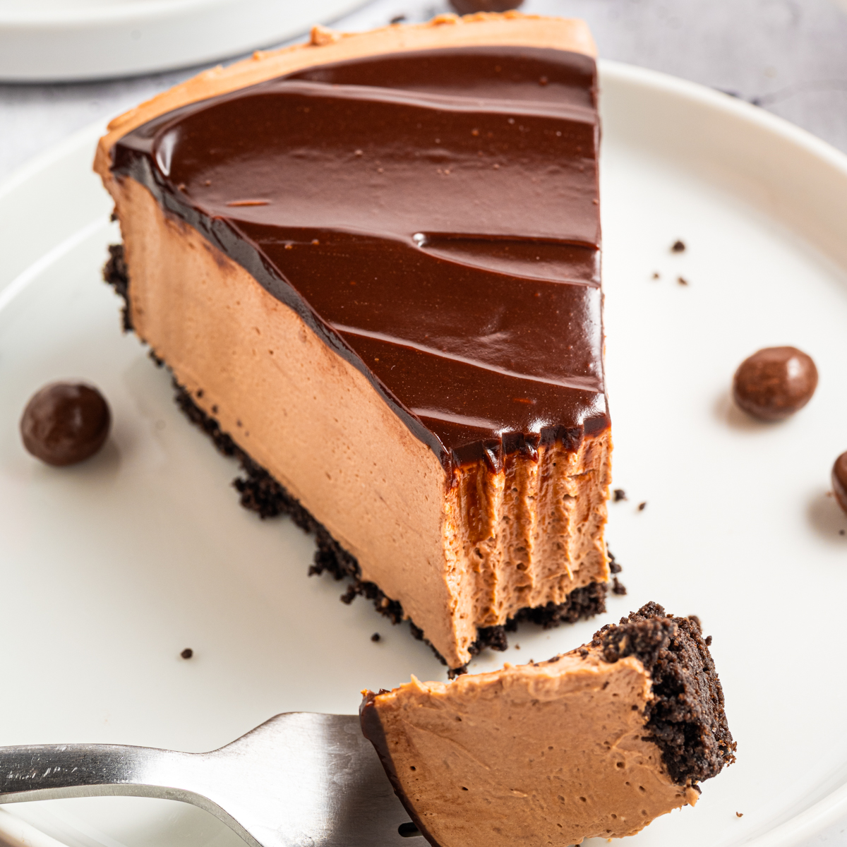 A slice of Mocha Cheesecake on a plate.