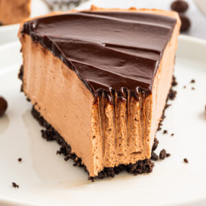 A slice of Mocha Cheesecake on a plate.