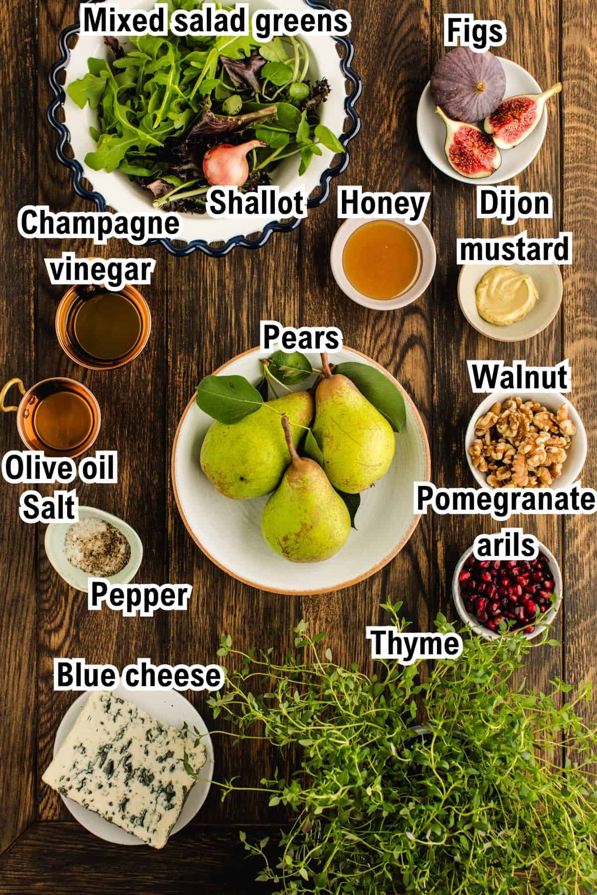 This photo shows all the ingredients (labeled) for Pear Salad with Honey-Mustard Dressing.
