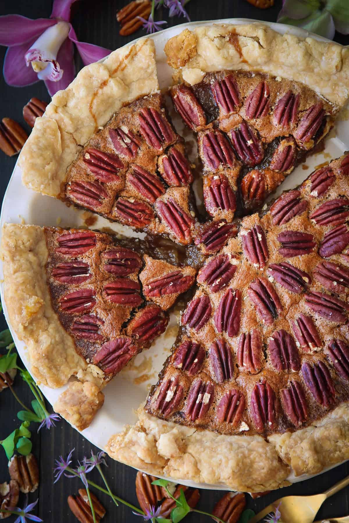 Pecan Pie in a white pie dish.