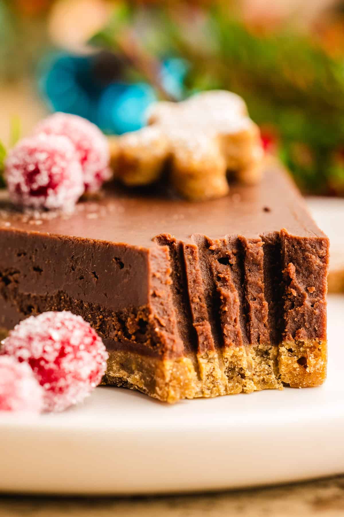 Slice of Gingerbread Chocolate Tart with a fork bite taken out - on a plate.