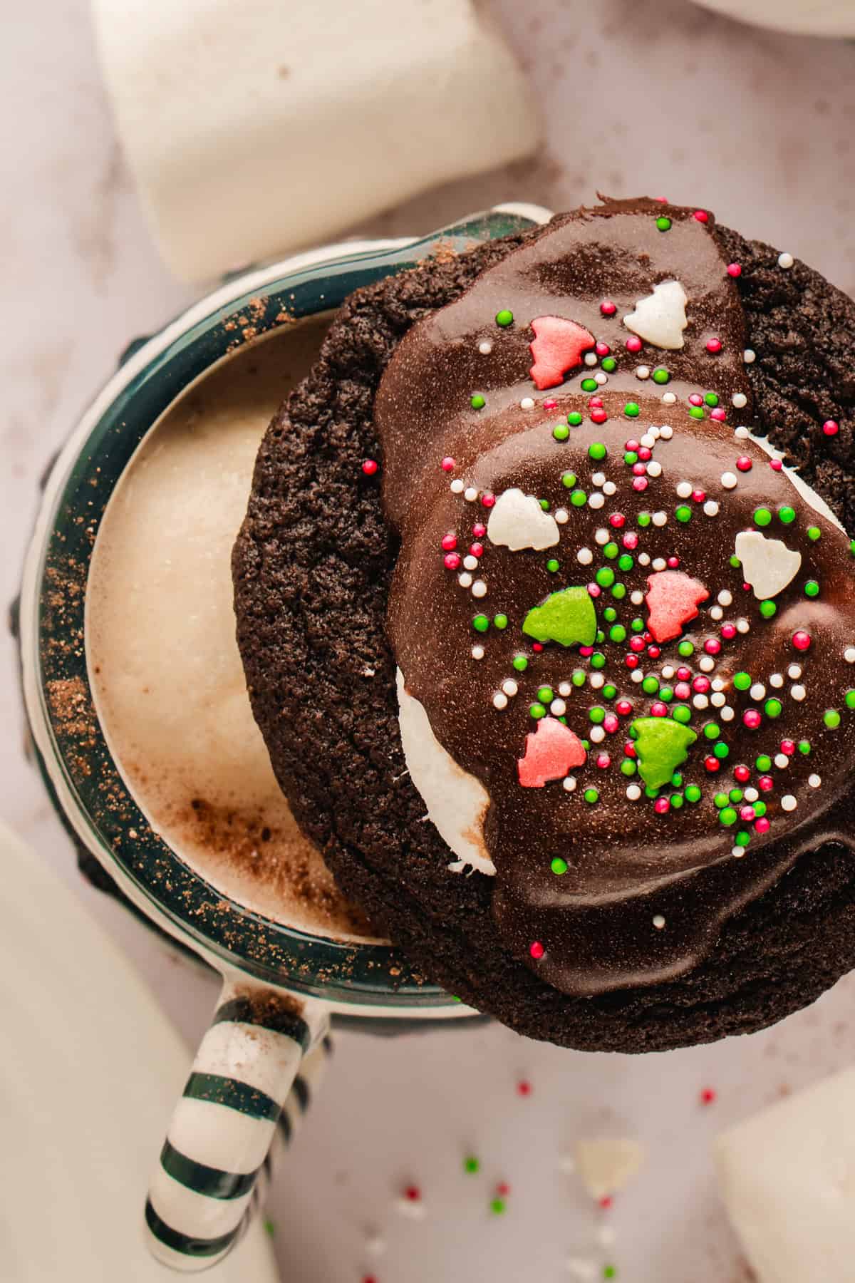 Hot Cocoa Cookies Delicious chocolate lava cake with colorful sprinkles, served in a mug, perfect for desserts and baking recipes.