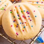 Whipped Shortbread Cookies with sprinkles - on a rack.