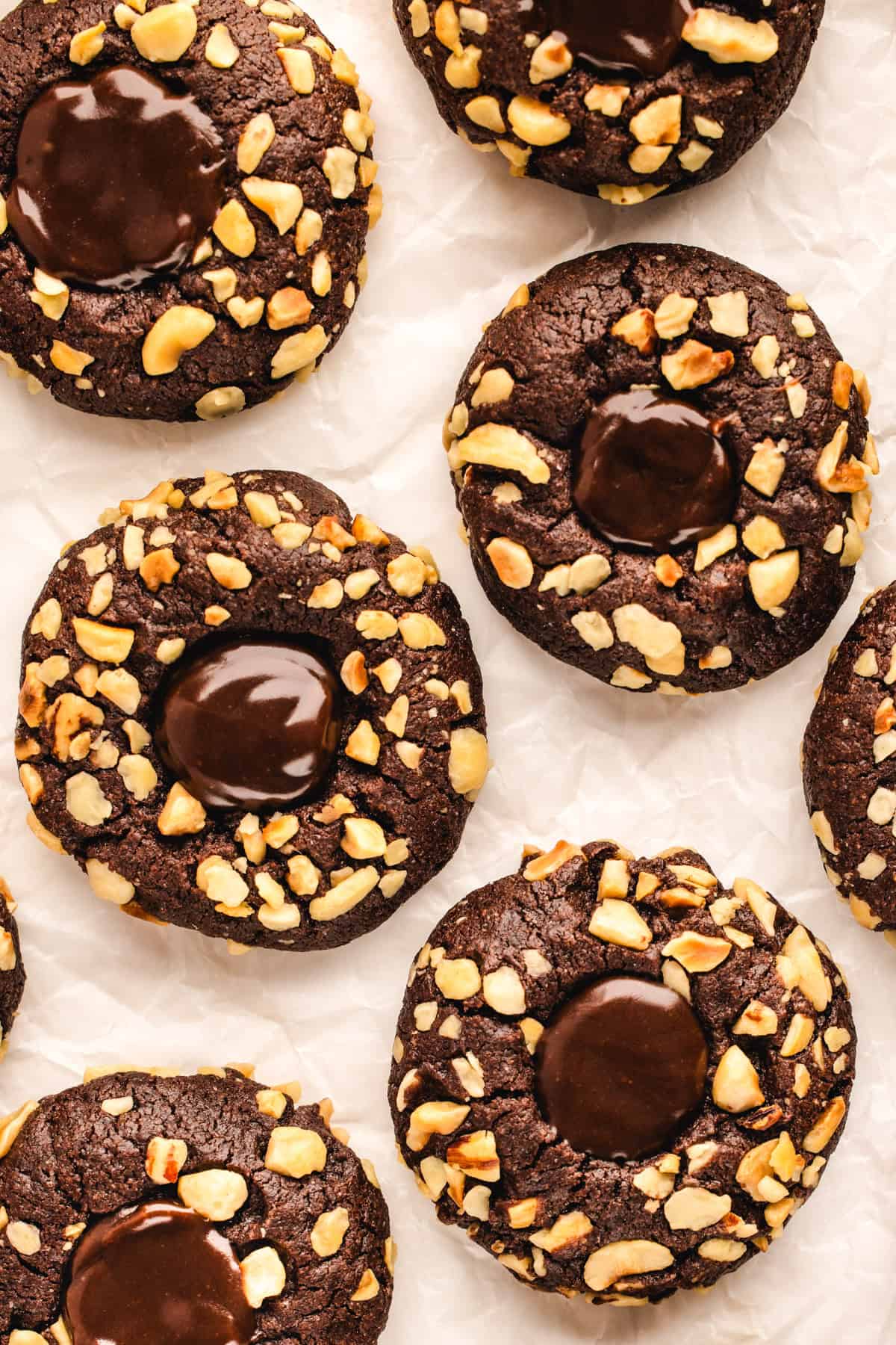 Chocolate Hazelnut Thumbprint Cookies Chocolate Hazelnut Thumbprint Cookies on a white background.