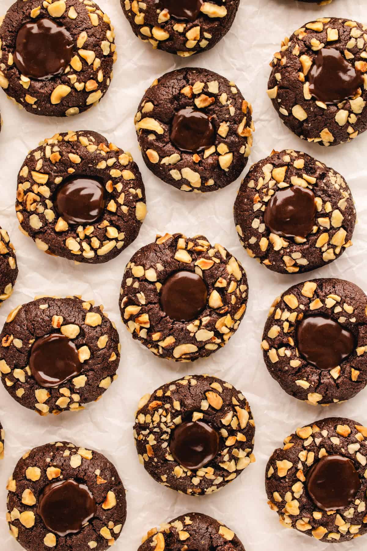 Chocolate Hazelnut Thumbprint Cookies Chocolate Hazelnut Thumbprint Cookies on a white background.
