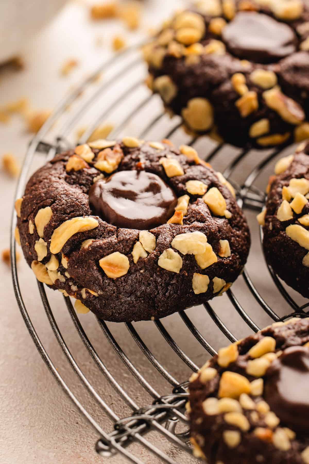 Chocolate Hazelnut Thumbprint Cookies Chocolate Hazelnut Thumbprint Cookies on a rack.
