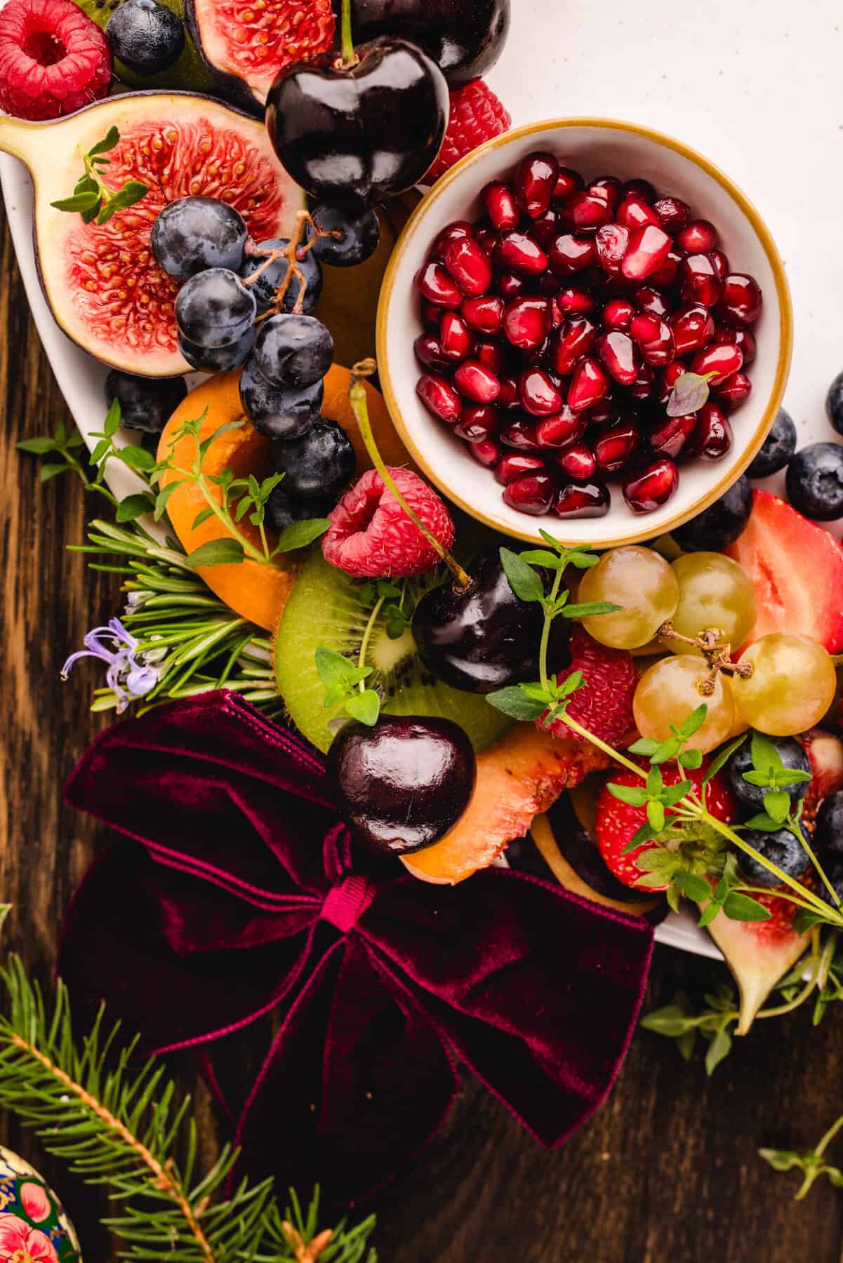 Fruit Platter Fruit platter with a small bowl of pomegranate arils.