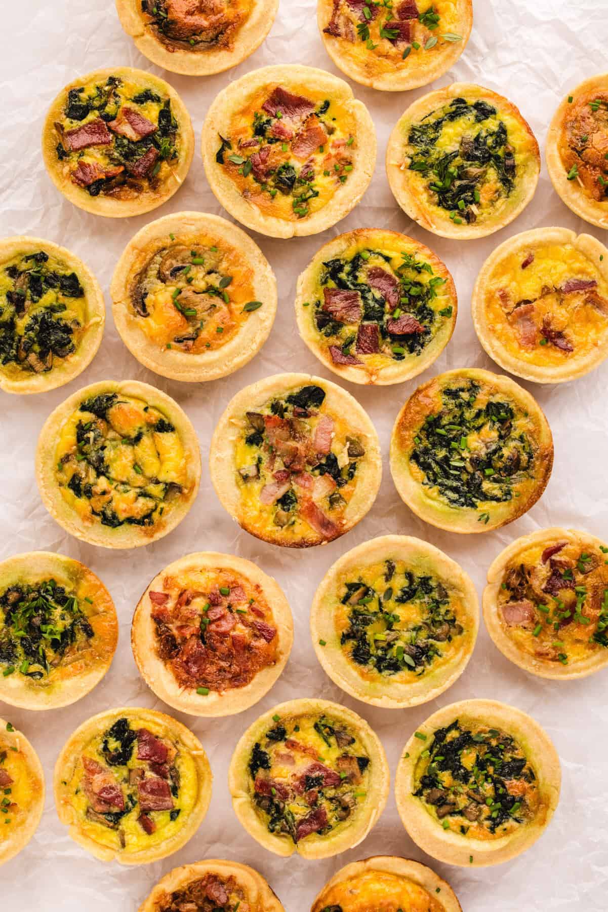 Mini Quiches (filled with cheese, eggs, bacon, spinach).