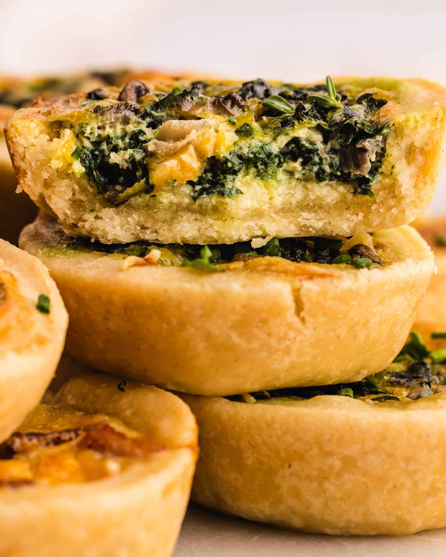 Mini Quiches (filled with cheese, eggs, bacon, spinach).
