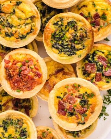 Mini Quiches (filled with cheese, eggs, bacon, spinach).