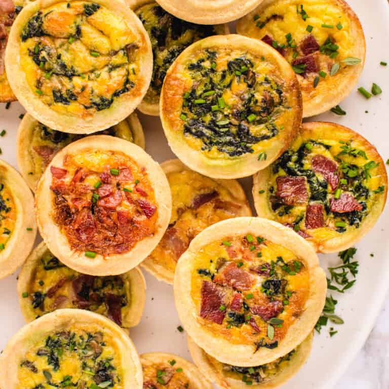Mini Quiches (filled with cheese, eggs, bacon, spinach).