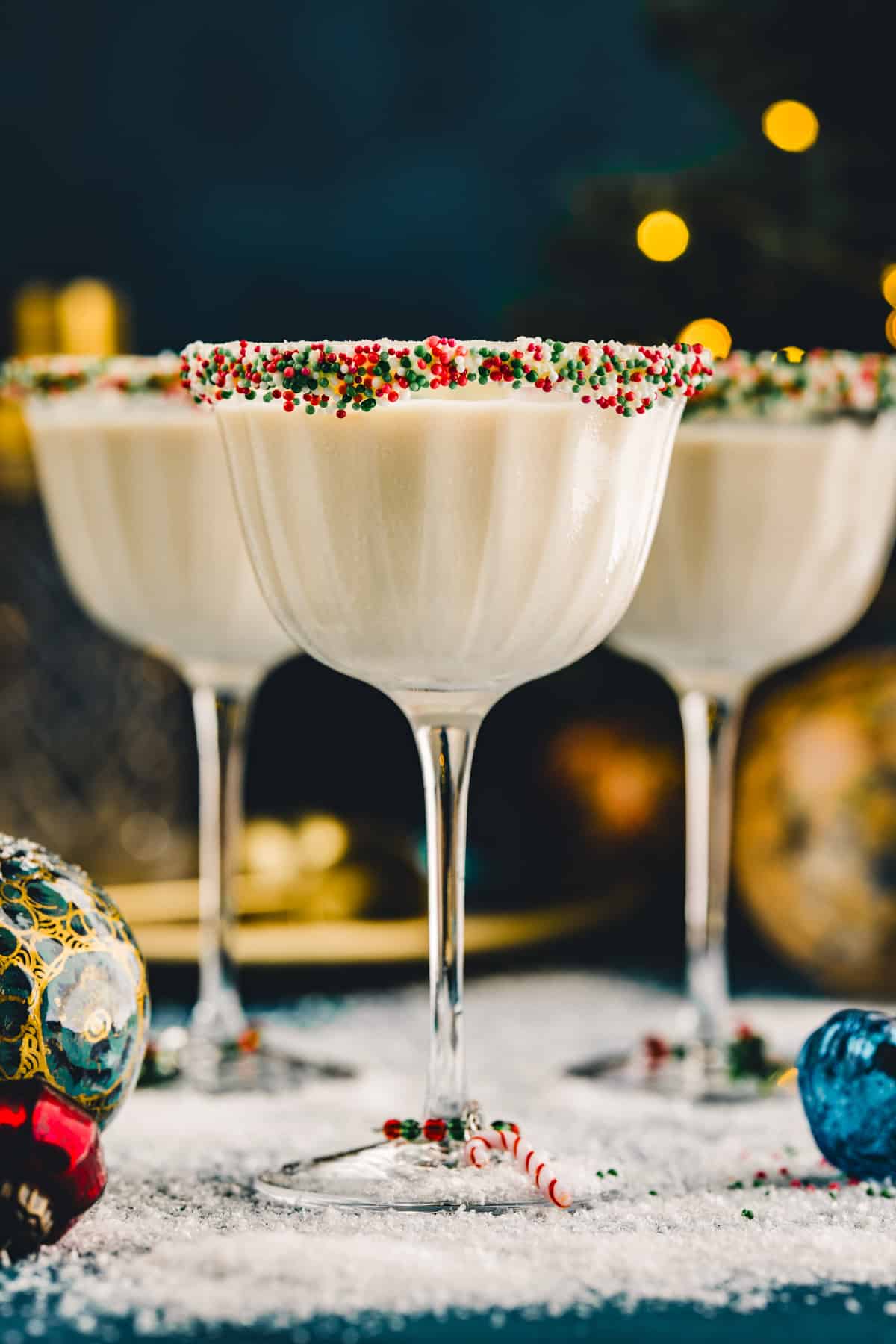 3 glasses of Sugar Cookie Martini (with holiday sprinkles on the rim).