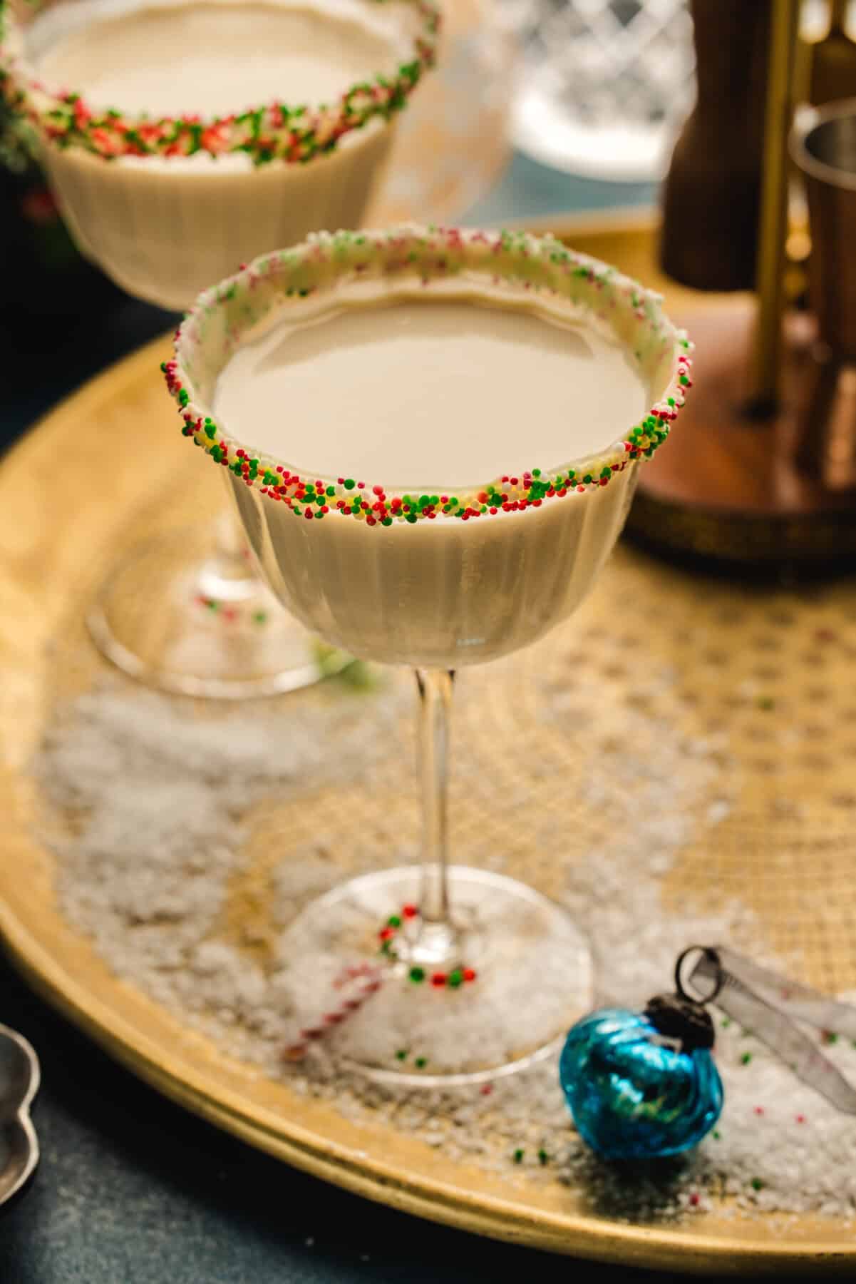 Sugar Cookie Martini (with festive holiday sprinkles around the rim of the martini glass).