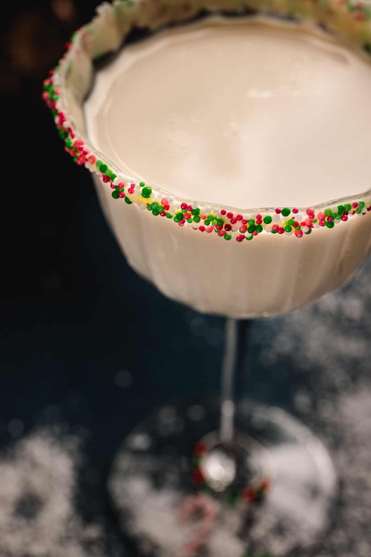 Sugar Cookie Martini (with festive holiday sprinkles around the rim of the martini glass).