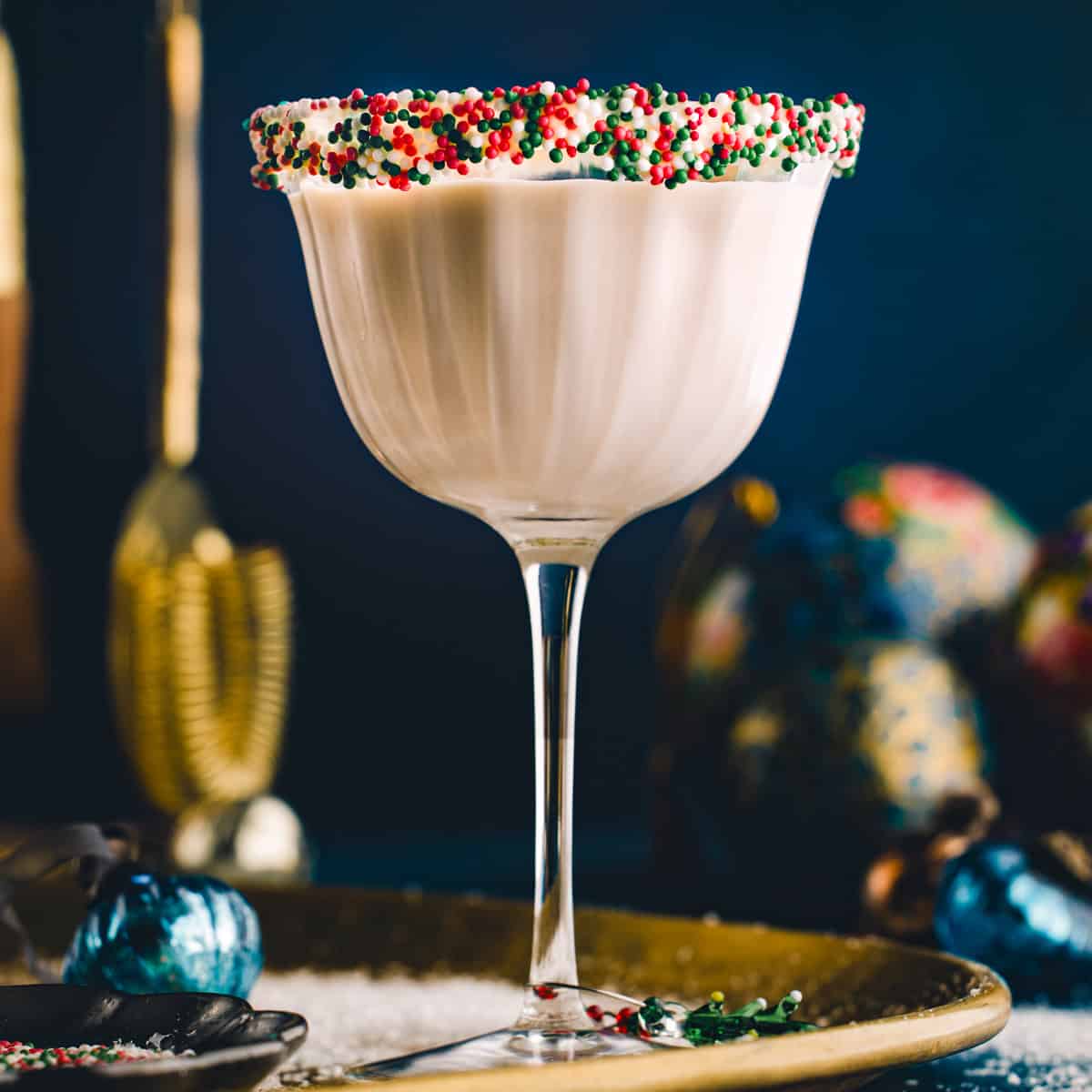 Sugar Cookie Martini (with festive holiday sprinkles around the rim of the martini glass).