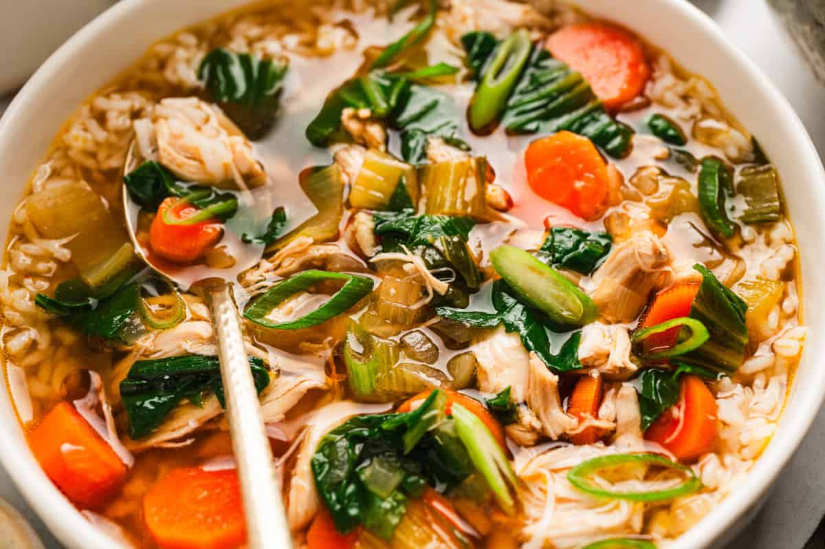Asian Chicken and Rice Soup with Carrots, Bok Choy, and Rice - in a bowl.