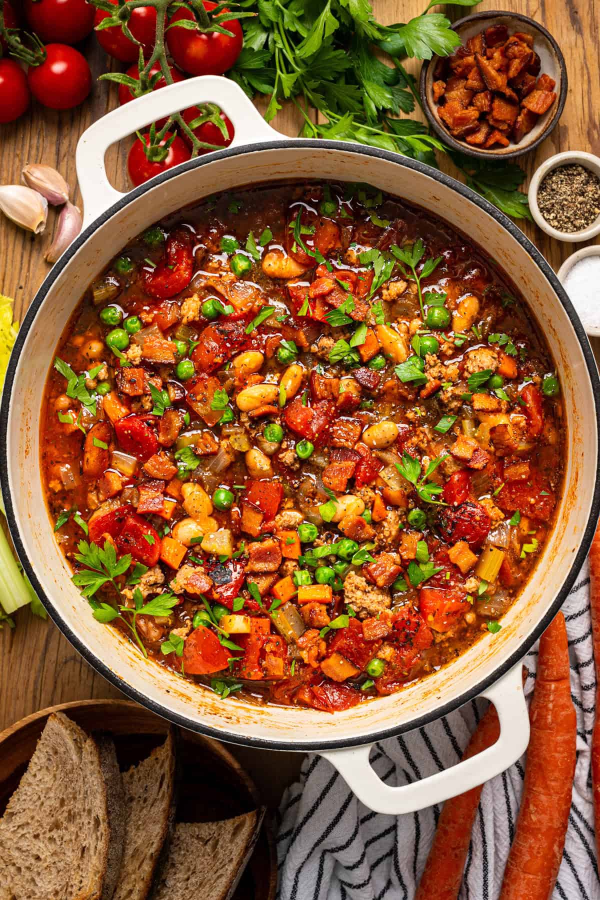 Ground Turkey Soup with Carrots, Peas, Beans, Bacon, Tomatoes, Herbs - in a Dutch oven.