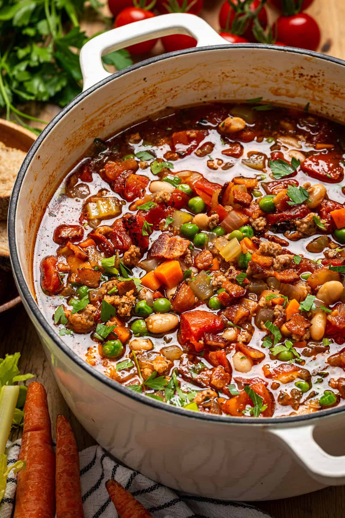 Ground Turkey Soup with Carrots, Peas, Beans, Bacon, Tomatoes, Herbs - in a Dutch oven.