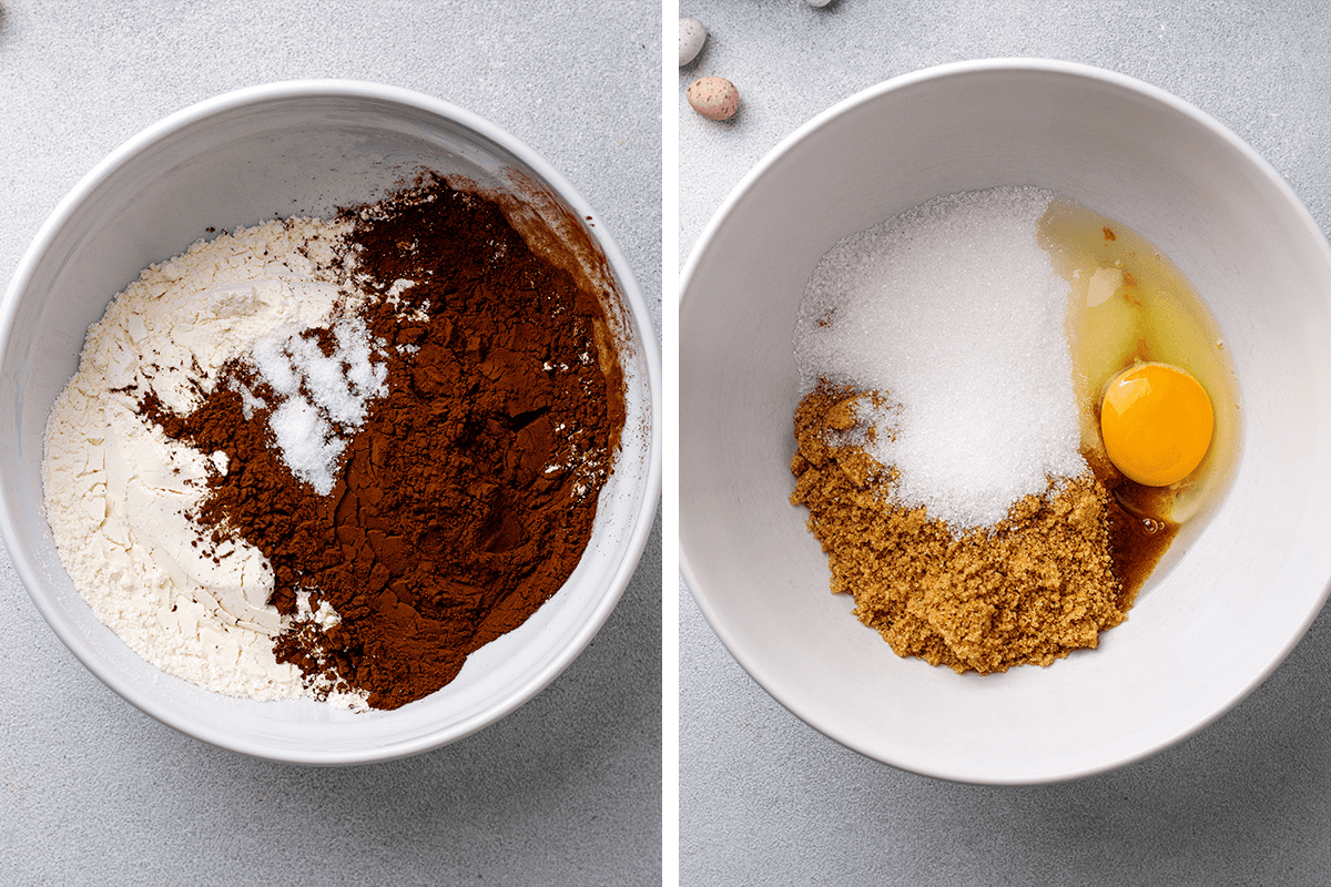 Two white bowls seen from above: one with flour, cocoa powder, and salt; the other with brown sugar, white sugar, egg, and vanilla. Both bowls are on a light gray surface.
